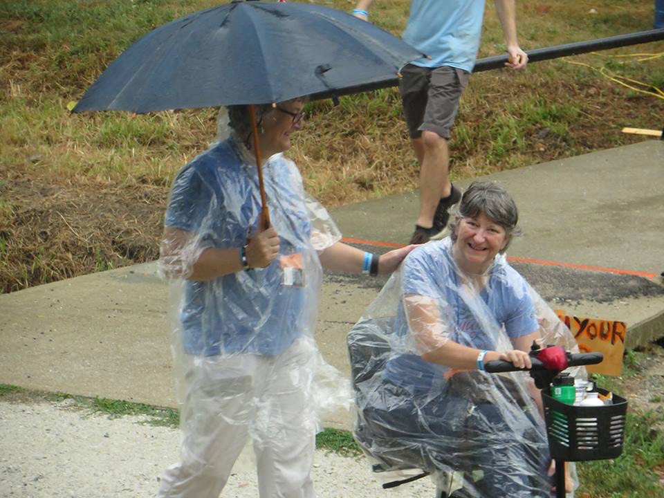 walking in the rain with a scooter wheelchair